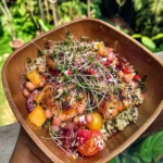 Summer herb meal prep bowl with grilled chicken, quinoa, cherry tomatoes, and fresh microgreens in wooden bowl