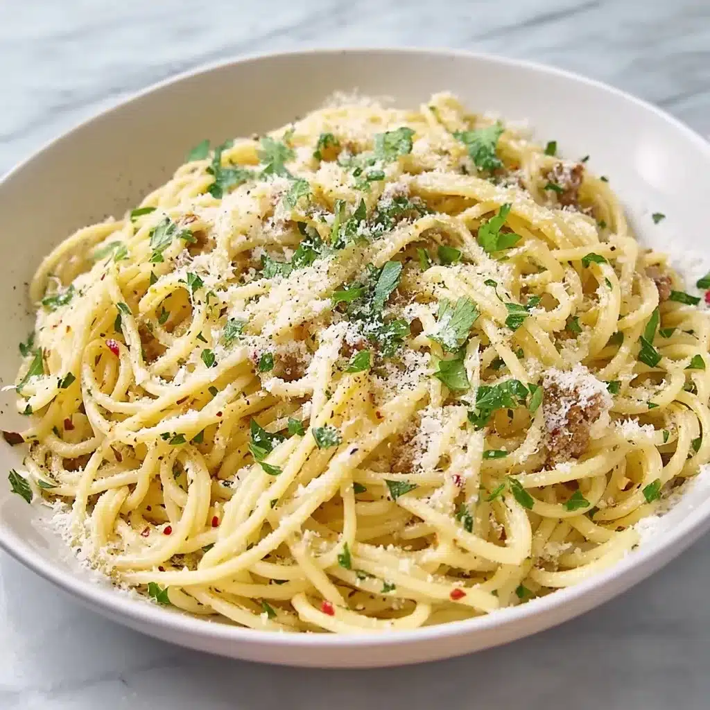 Homemade sizzling spaghetti with meat sauce, fresh basil, and Parmesan in ceramic bowl