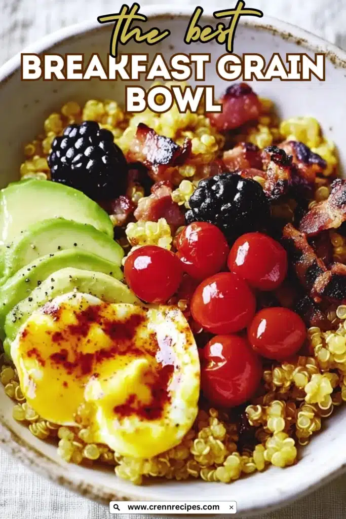 The best breakfast grain bowl recipe with quinoa, eggs, avocado, tomatoes, and berries with recipe title overlay