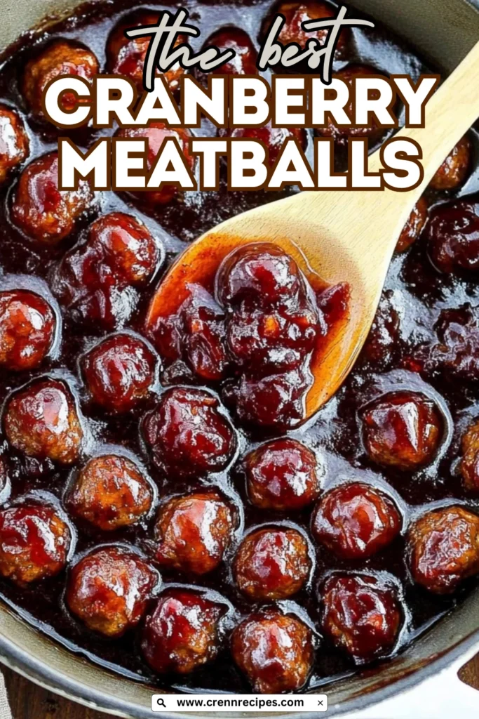 Recipe banner for "the best cranberry meatballs" with text overlay on image of glazed meatballs in skillet