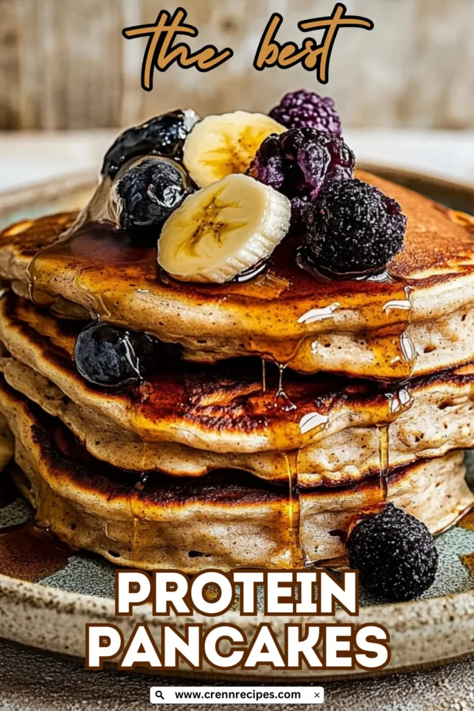 Stack of protein pancakes topped with banana slices and mixed berries with "the best" text overlay
