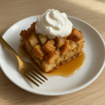 Single-serve apple French toast casserole served with syrup and whipped cream