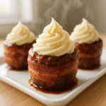 Smoky bourbon BBQ bacon-wrapped meatloaf cupcakes with mashed potato frosting served fresh