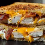 Chicken Bacon Ranch Grilled Cheese sandwich with melted cheddar cheese crispy bacon and tender chicken