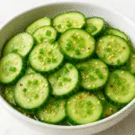 Refreshing cucumber salad with MSG featuring crisp Persian cucumbers, sesame oil, and rice vinegar - perfect summer side dish