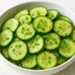 Refreshing cucumber salad with MSG featuring crisp Persian cucumbers, sesame oil, and rice vinegar - perfect summer side dish