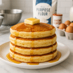 Fluffy pancake recipe - golden stacked pancakes with maple syrup on white plate showcasing CrennRecipes premium cooking techniques