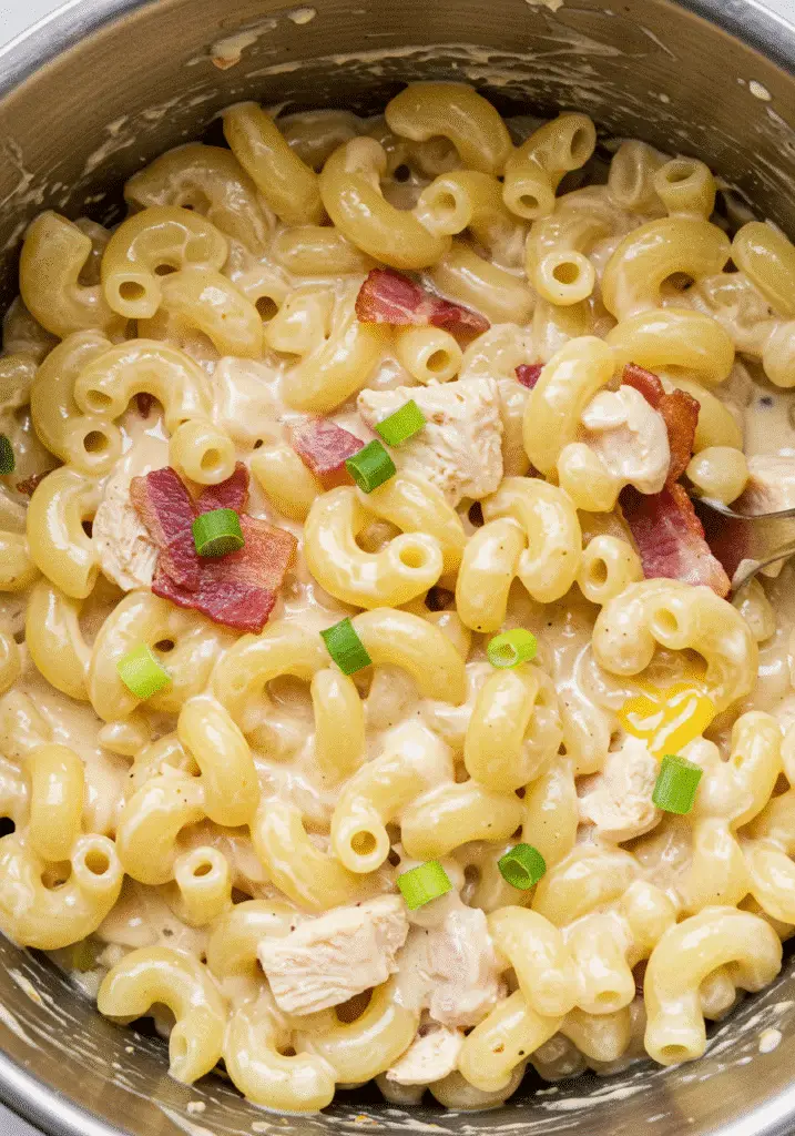 Chicken Bacon Ranch Macaroni comfort food recipe with melted cheese and fresh green onions garnish