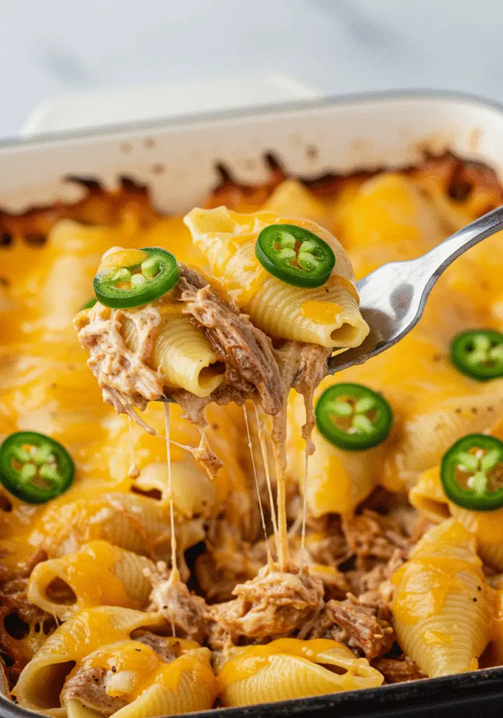 Pinterest-ready smoky jalapeño cheddar pulled pork pasta with golden cheese topping and premium ingredients