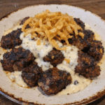 How to make Blackened Steak Tips With Creamy Garlic Cheese Sauce And Crispy Onion Crunch — key cooking step